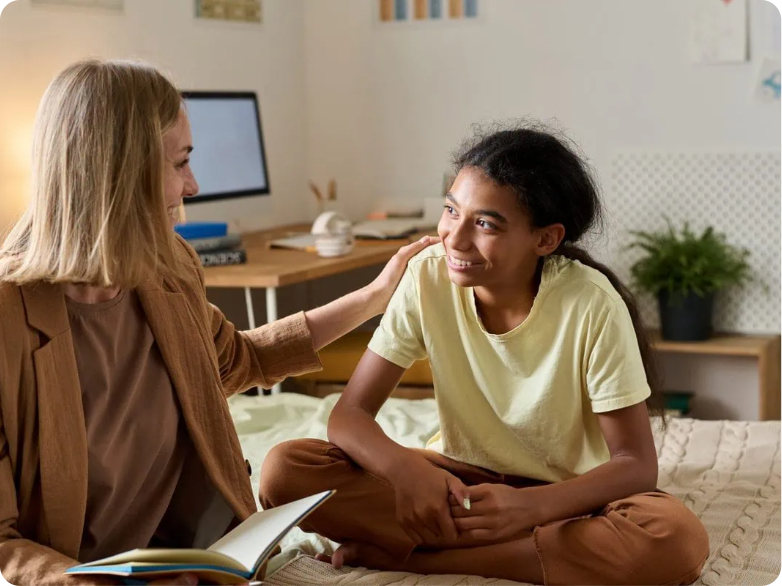 Teen talking with a psychologist in a bedroom