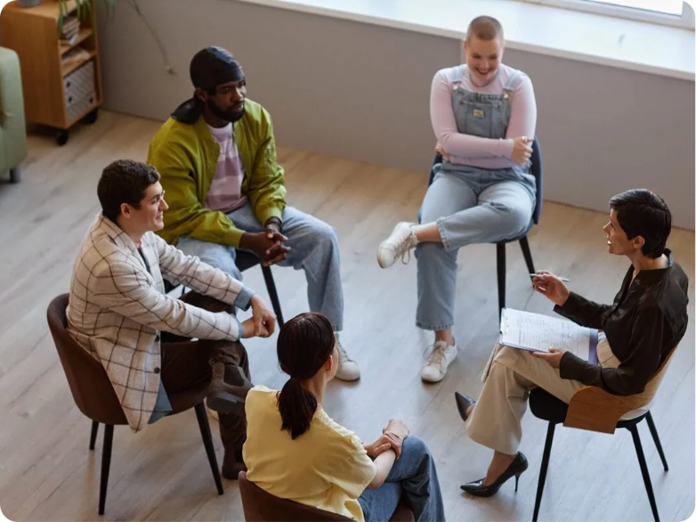 People talking with a specialist in a group setting