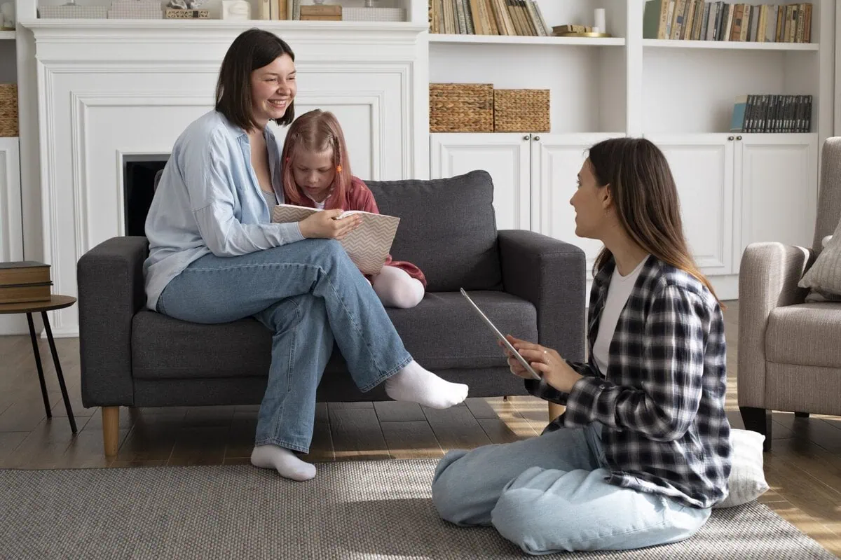 Two mothers spending time together with their daughter