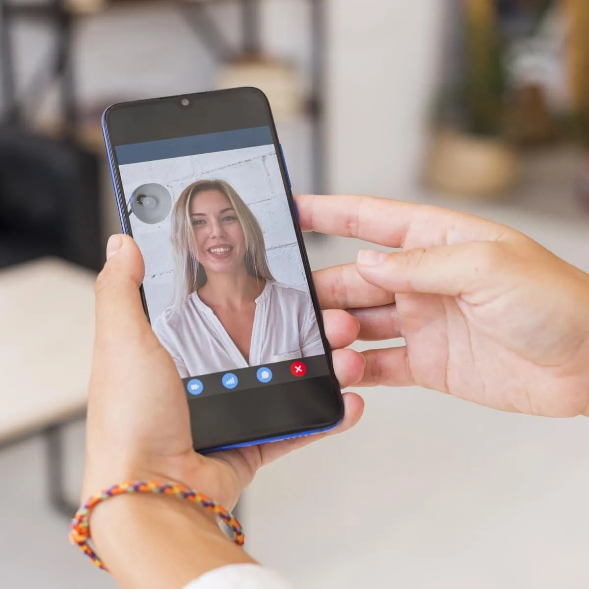 A person holding a smartphone, representing accessible telehealth anxiety therapy